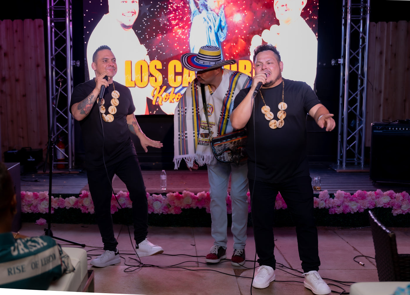 Live Colombian musicians on stage with fireworks